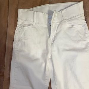 white apt. 9 skinny jeans with pocket detail.